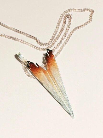 caleb scorched paper airplane necklace
